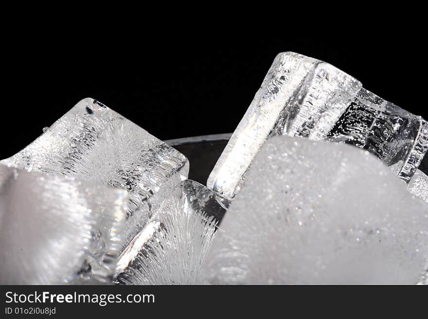 Ice an a glass on a black background