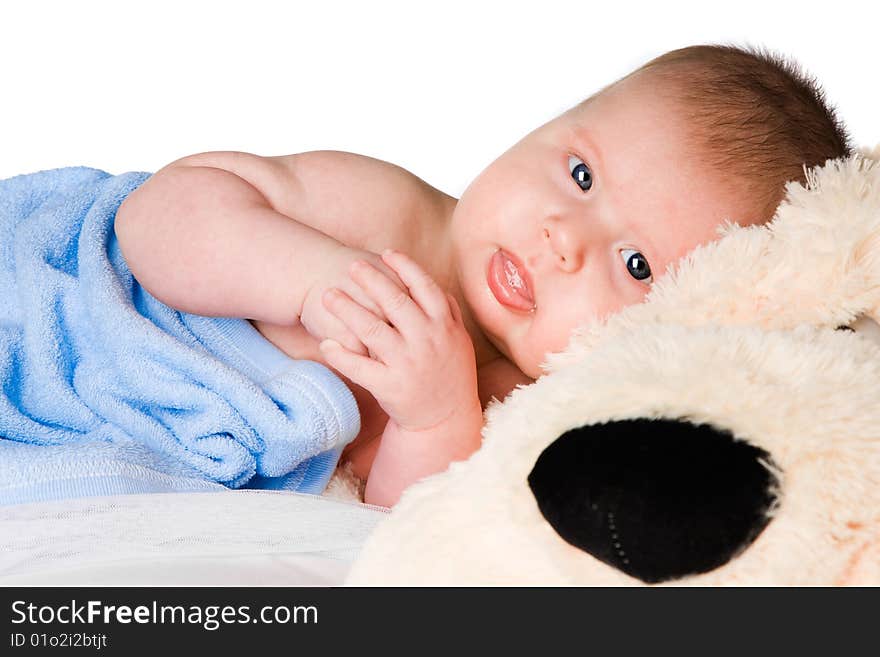 Baby in blue bath towel studio shot