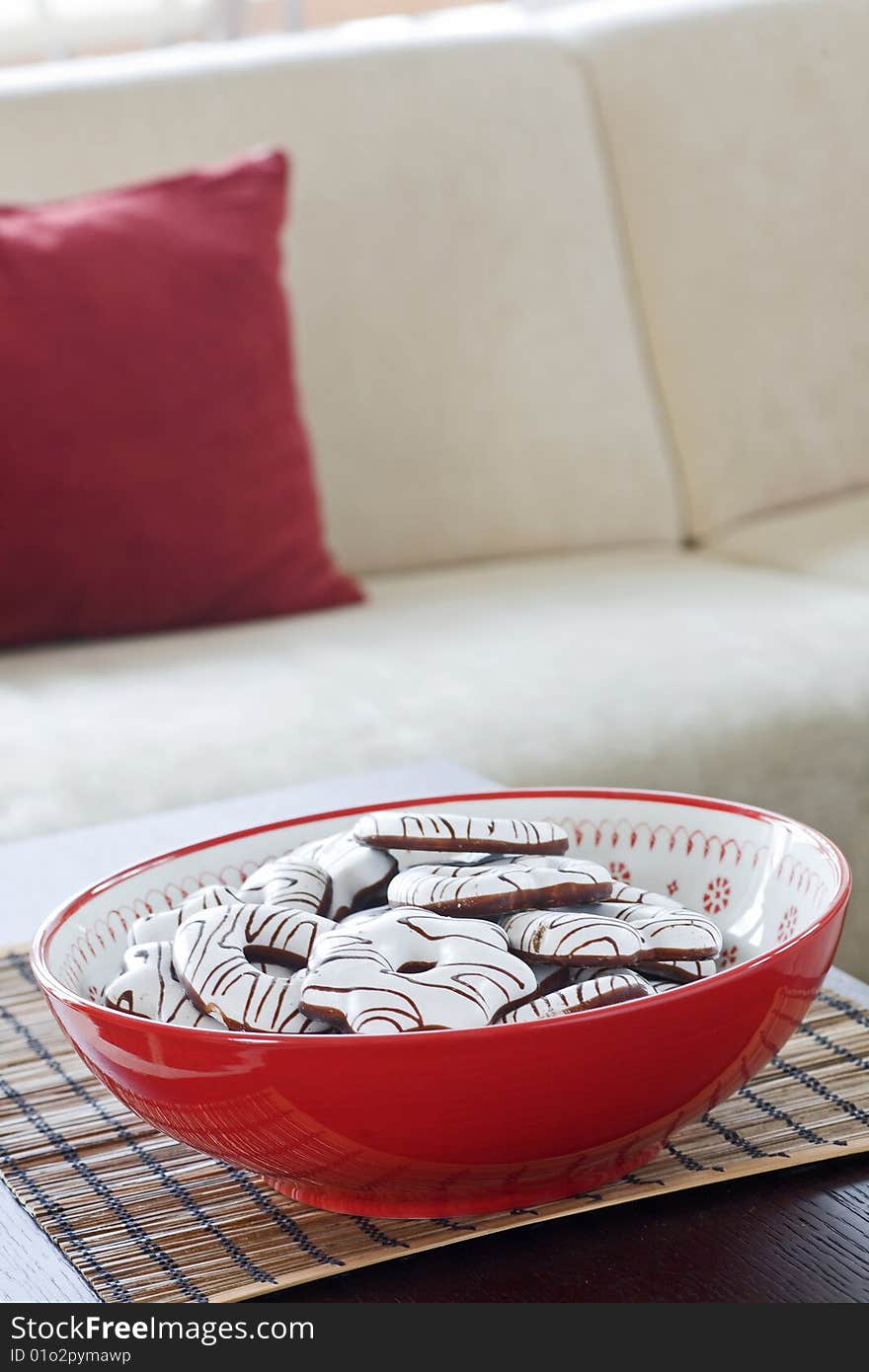 Detailed cookies on table with sofa on background