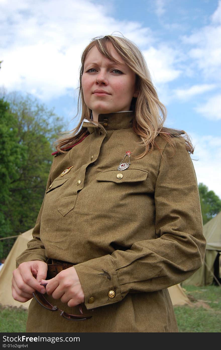 KIEV, UKRAINE - MAY 9: A member of history club called Red Star wear historical Soviet uniform as she participates in a WWII reenactment May 9, 2009 in Kiev, Ukraine. KIEV, UKRAINE - MAY 9: A member of history club called Red Star wear historical Soviet uniform as she participates in a WWII reenactment May 9, 2009 in Kiev, Ukraine