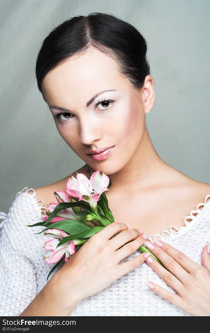 Portrait of young woman with pink orchid. Portrait of young woman with pink orchid