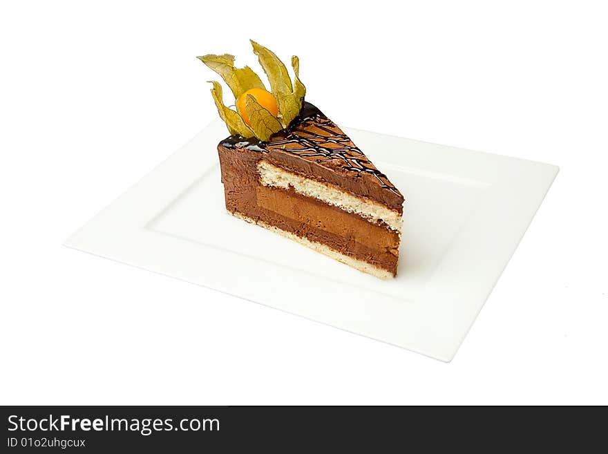 Chocolate cake with nut on white plate