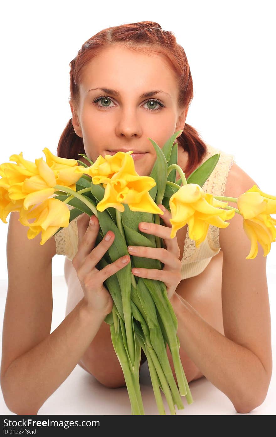 Cute young woman with yellow tulips. Cute young woman with yellow tulips