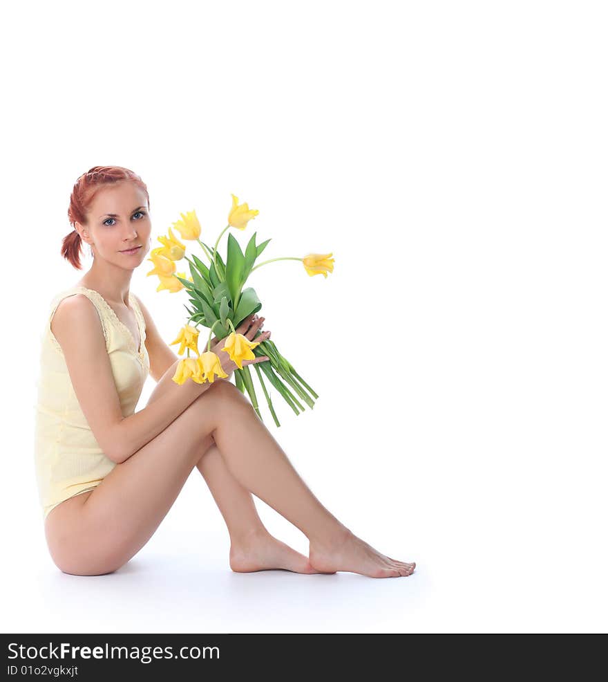 Cute young woman with yellow tulips. Cute young woman with yellow tulips