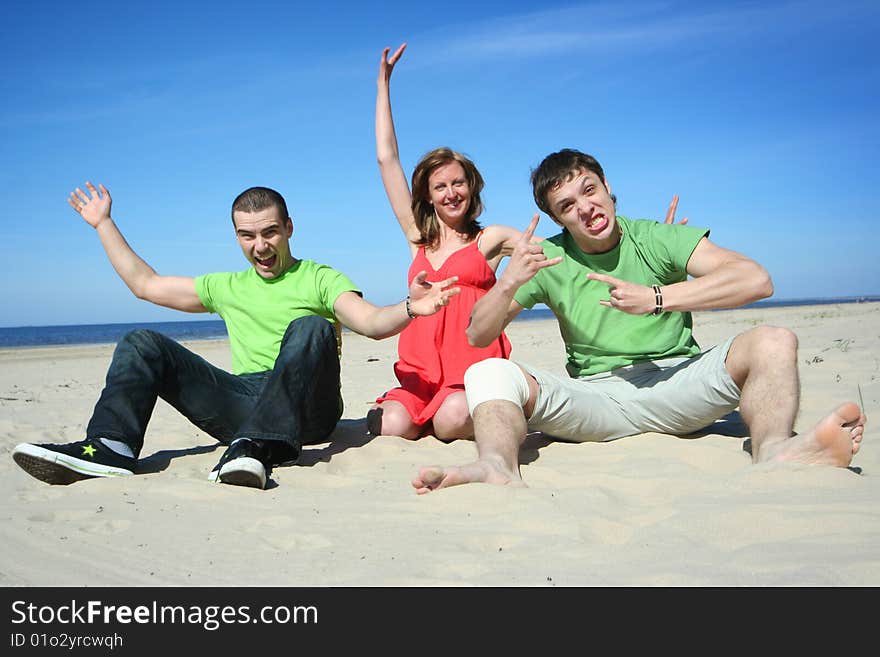 Group of friends having fun on the beach