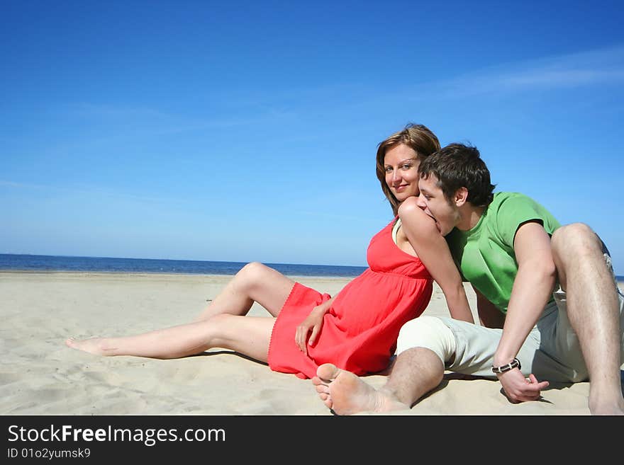 Young couple relaxing on the beach. Young couple relaxing on the beach