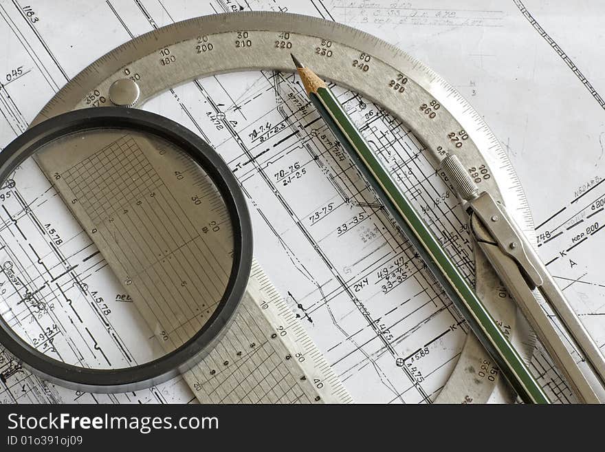 Engineering blueprint with pencil, steel protractor, compass and loupe. Engineering blueprint with pencil, steel protractor, compass and loupe