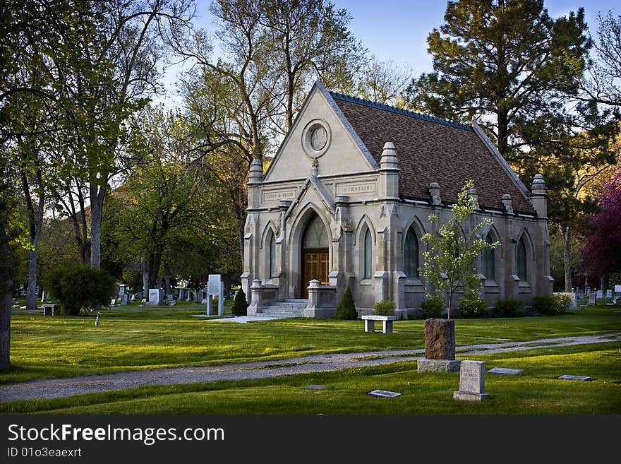 An old stone church in a cemetery