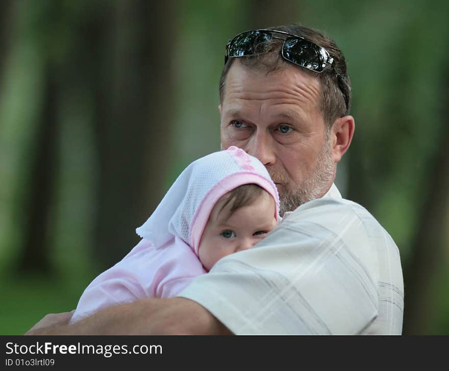 The grandfather with the grand daughter on walk. The grandfather with the grand daughter on walk