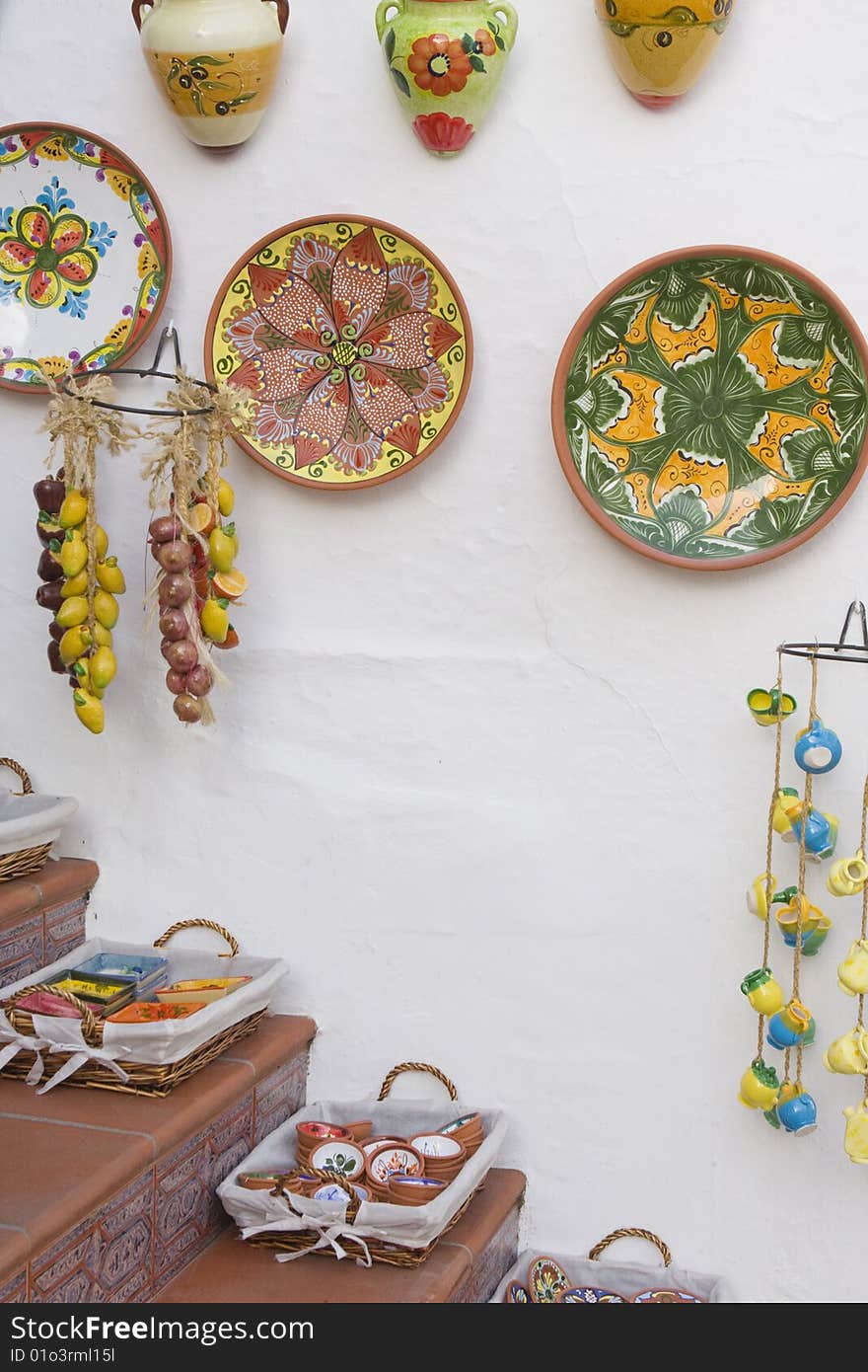 Brightly colored designs of a ceramics display outside a shop in Mijas, Spain invite visitors inside