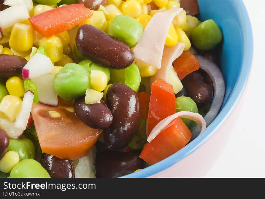 Fresh garden salad in a colorful bowl isolated on white background. Fresh garden salad in a colorful bowl isolated on white background