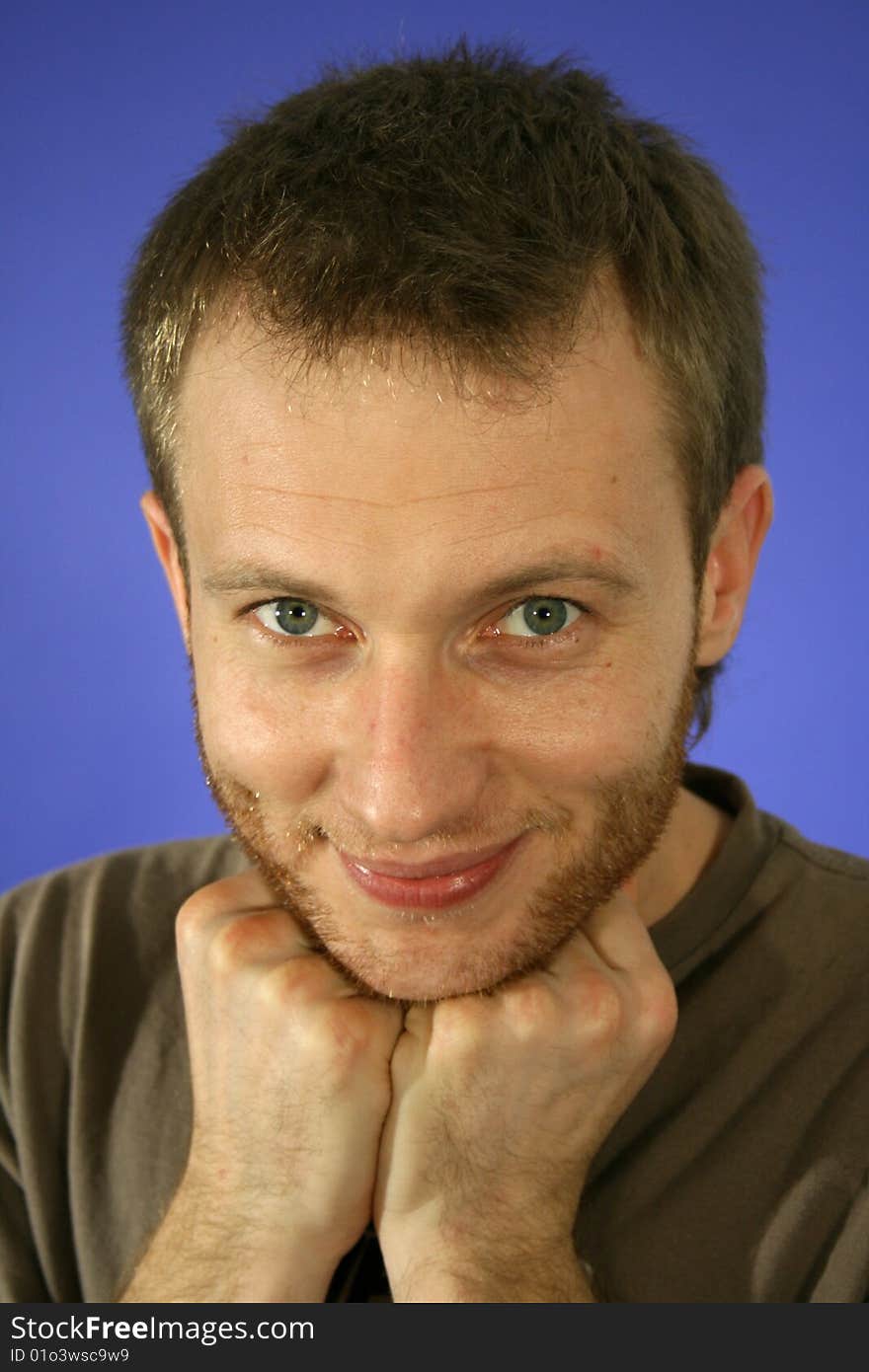 Portrait of man in studio on blue background. Portrait of man in studio on blue background