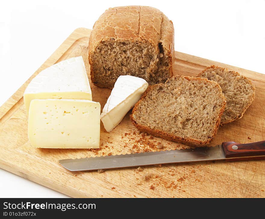 Bread and different cheeses on a white background. Bread and different cheeses on a white background