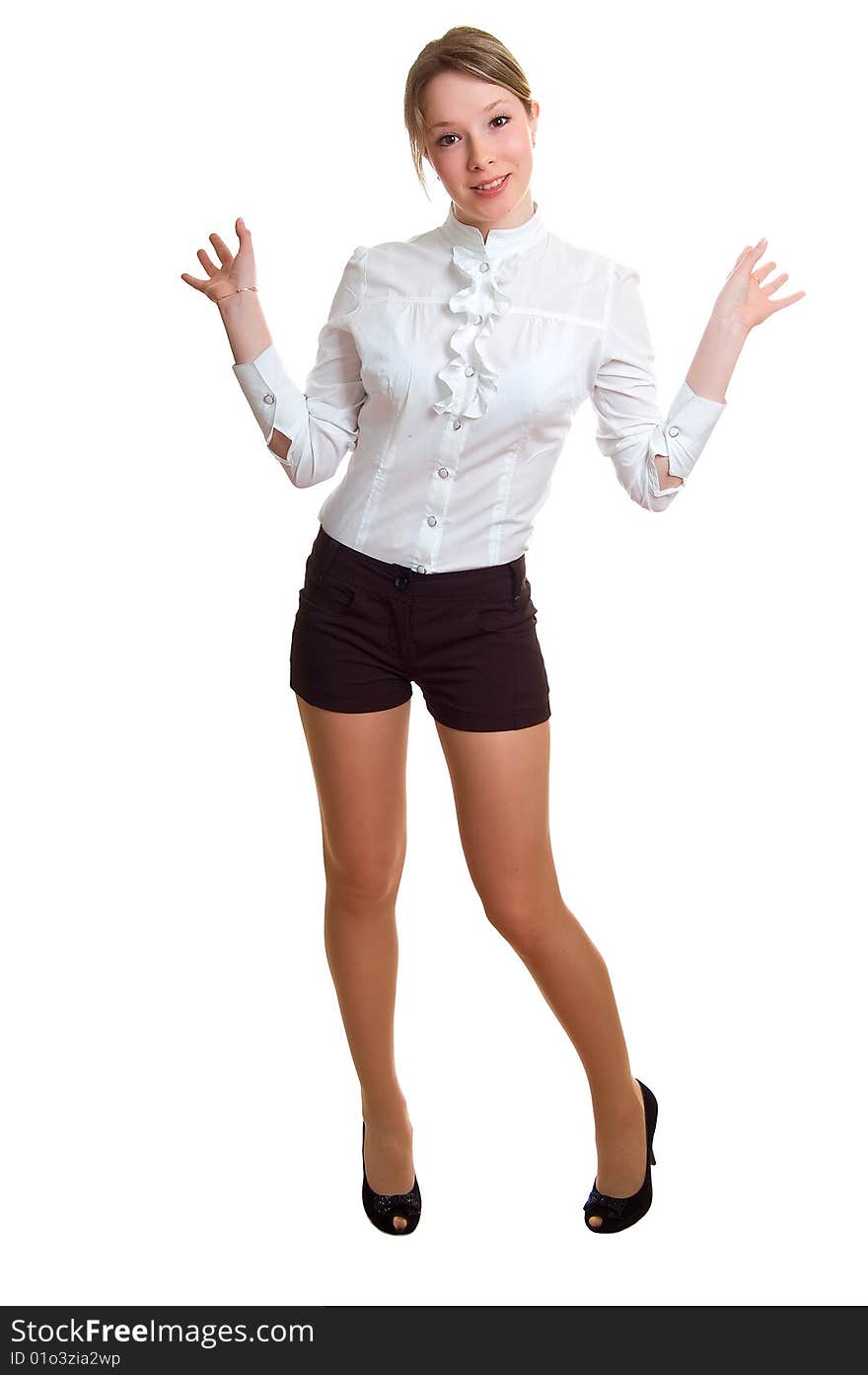 The young beautiful girl in a white shirt and black shorts. Isolation on a white background