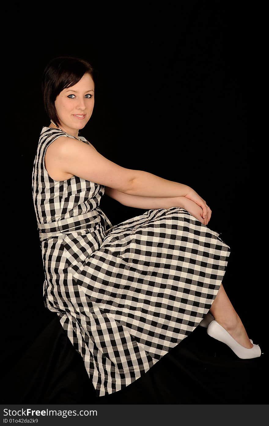 Pretty teenage woman on black background. Pretty teenage woman on black background