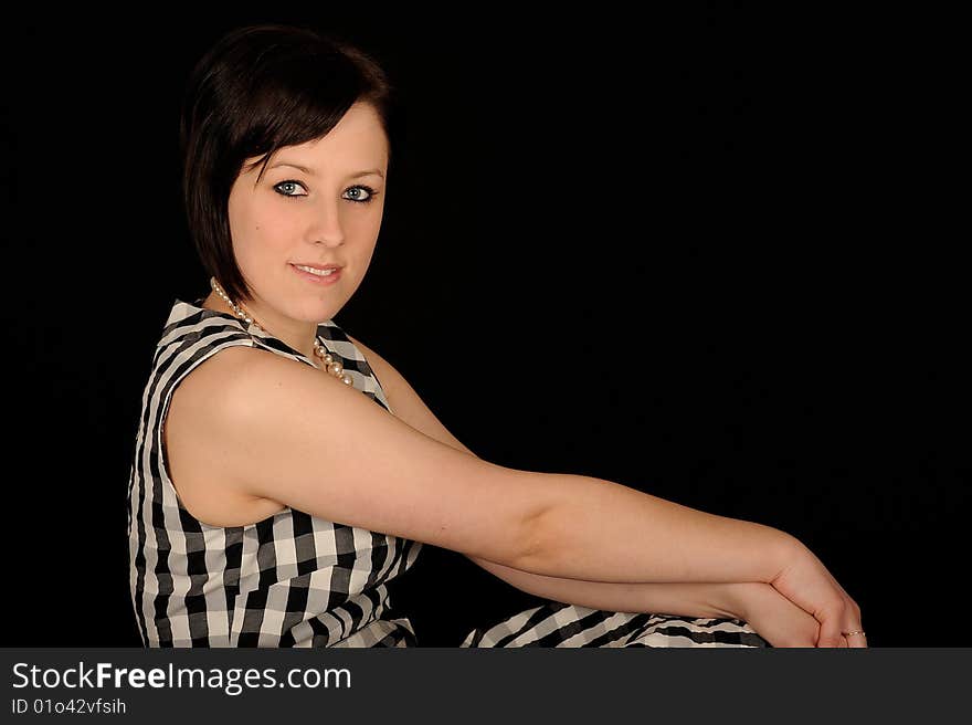 Pretty teenage woman on black background. Pretty teenage woman on black background