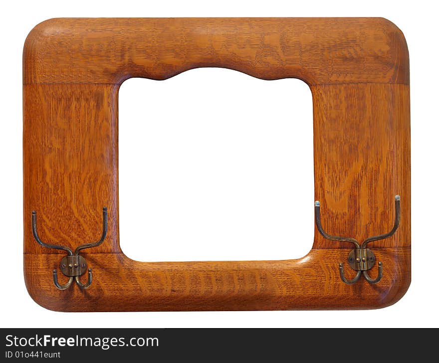 Isolated photo of an antique hat rack / picture frame made of oak. Isolated photo of an antique hat rack / picture frame made of oak