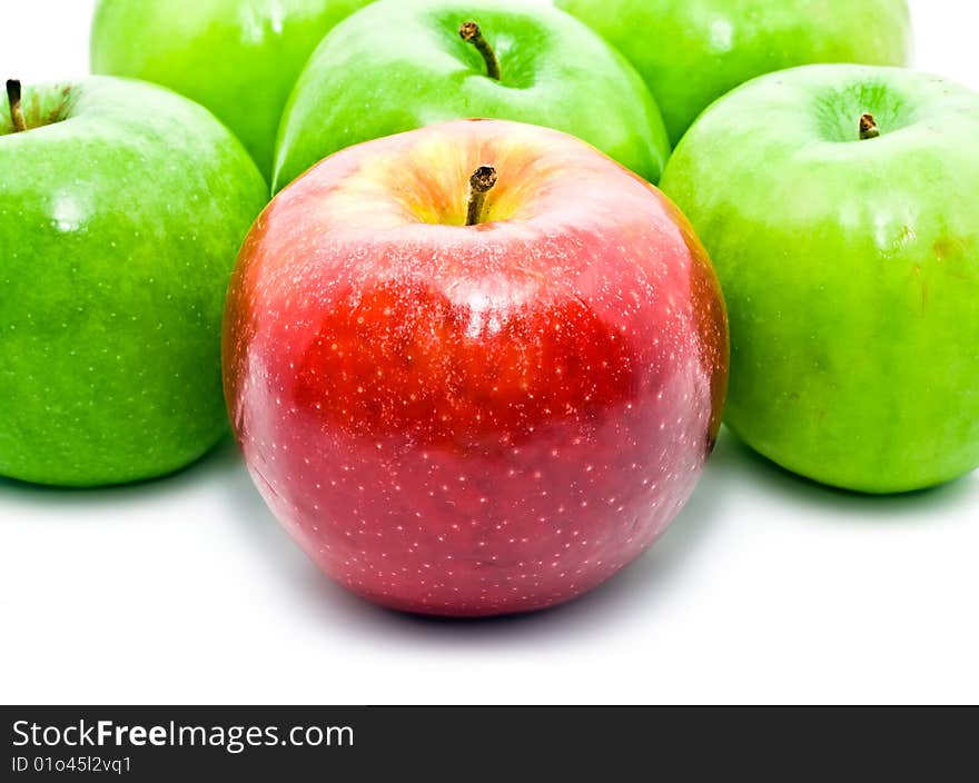 Red and green apples on white