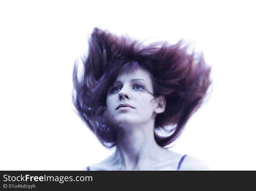 Young woman with blue eyes and red hair blowing by wind. Young woman with blue eyes and red hair blowing by wind