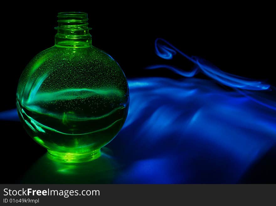 Green sphere with smoky background