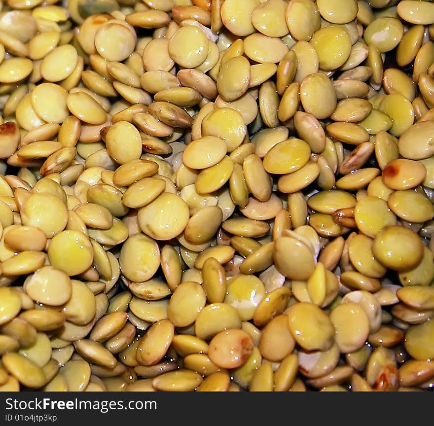 background of yellow lentils taken close-up