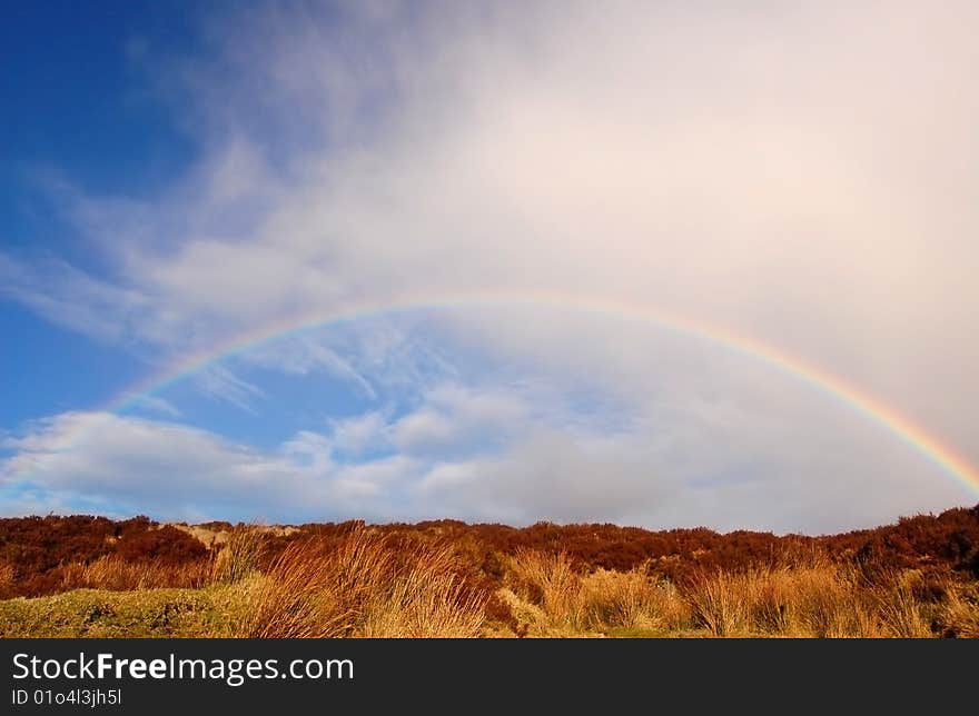 Rainbow over the heather hill in Wicklow Mountains, Ireland. Rainbow over the heather hill in Wicklow Mountains, Ireland