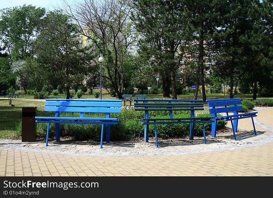 Three blue benches