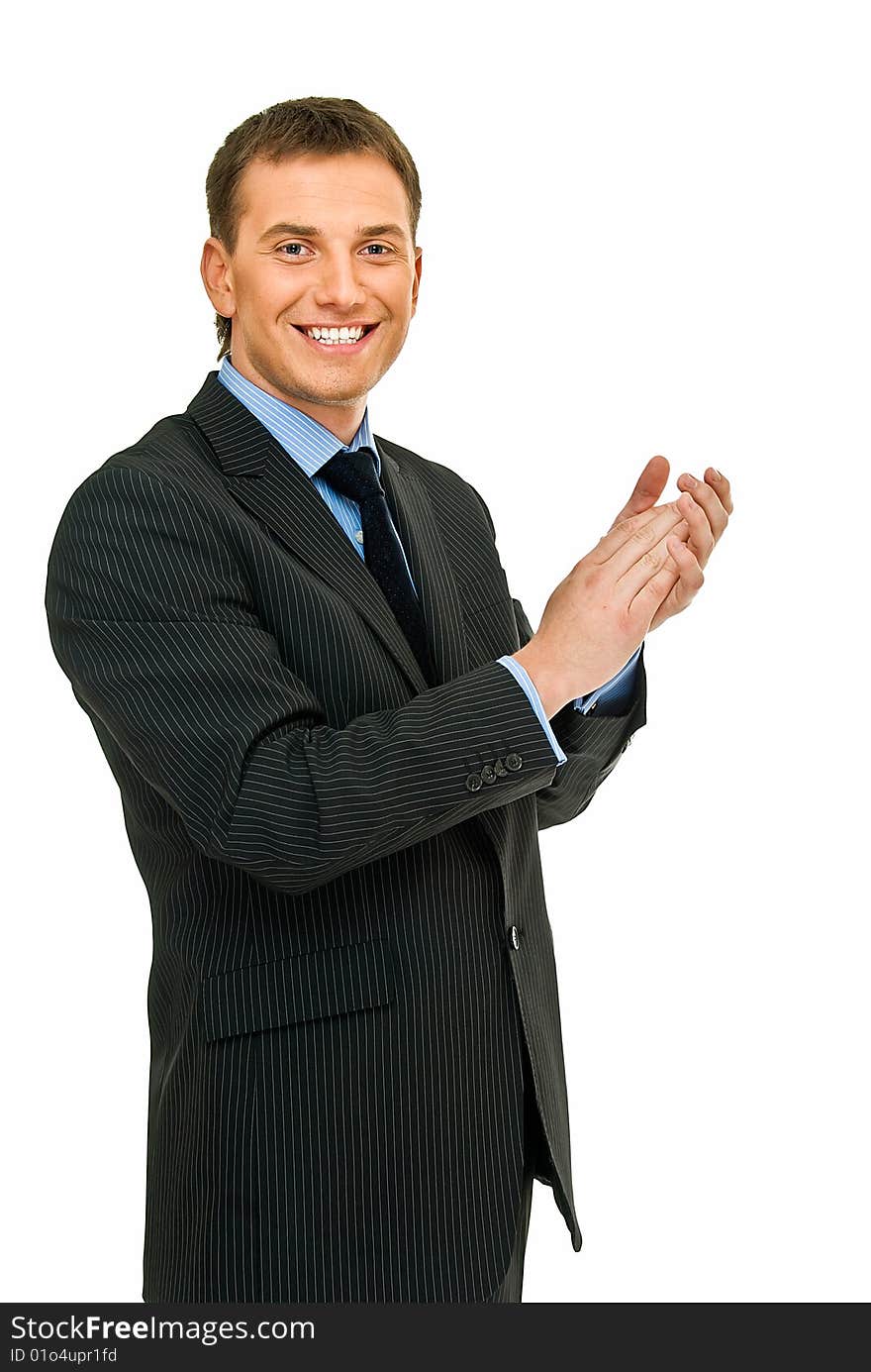 Young handsome businessman claps one`s hands on white. Young handsome businessman claps one`s hands on white