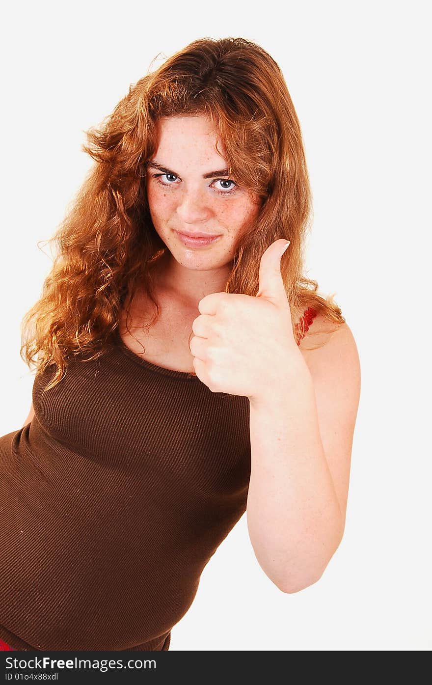 Lovely red long haired girl shooing booths thumbs up for good luck for the task she is starting now. Lovely red long haired girl shooing booths thumbs up for good luck for the task she is starting now.