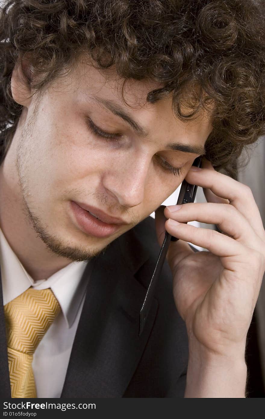 Close up portrait of business man with mobile phone