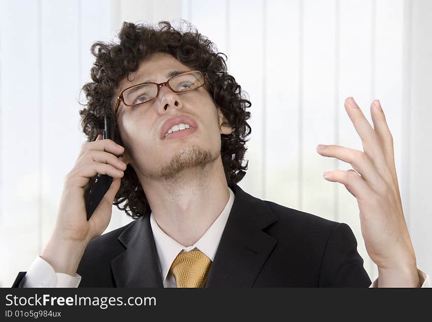 Business man with mobile phone in the office