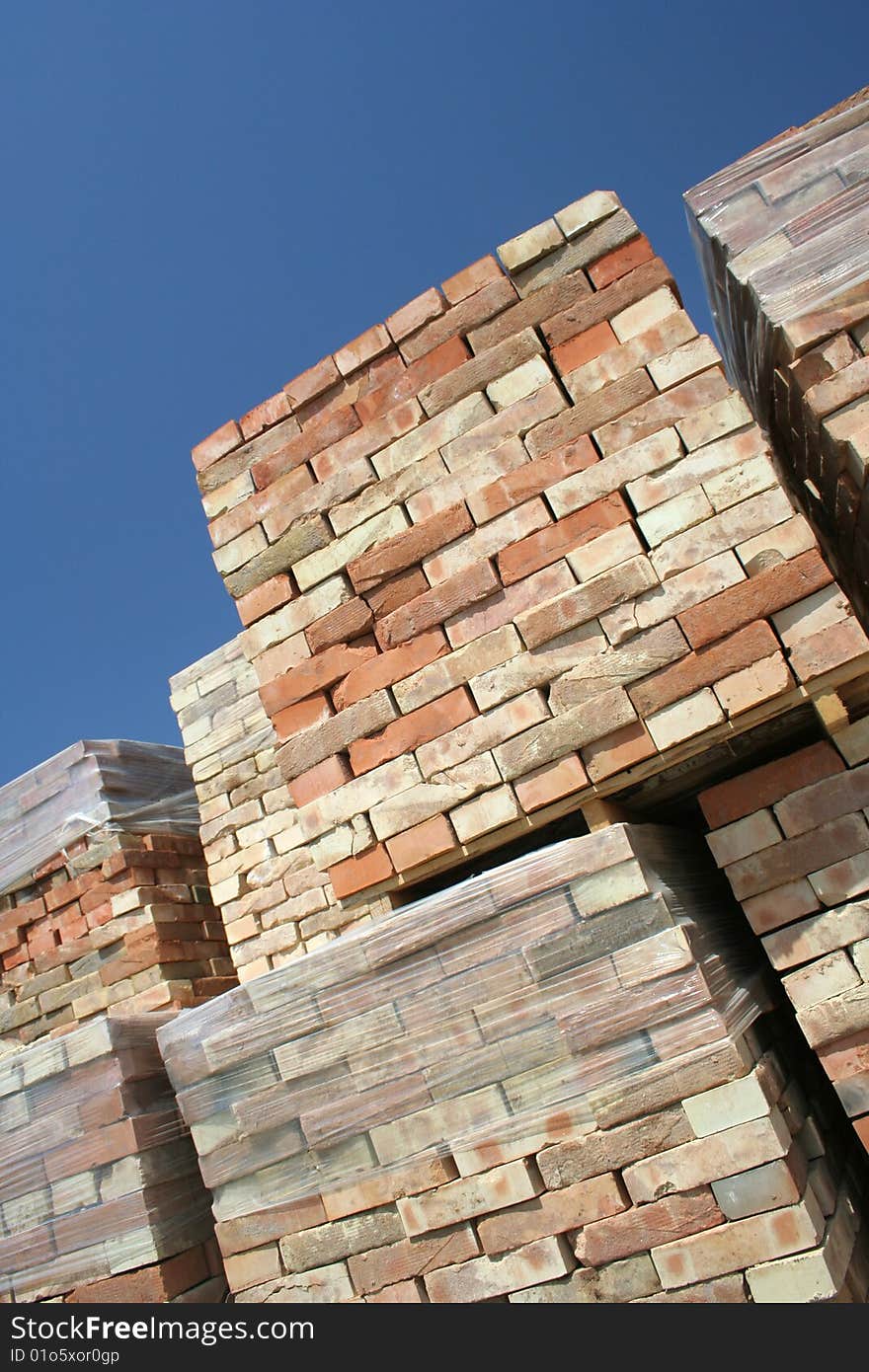 Pile of bricks on the assembly yard ready to be putted in the wall