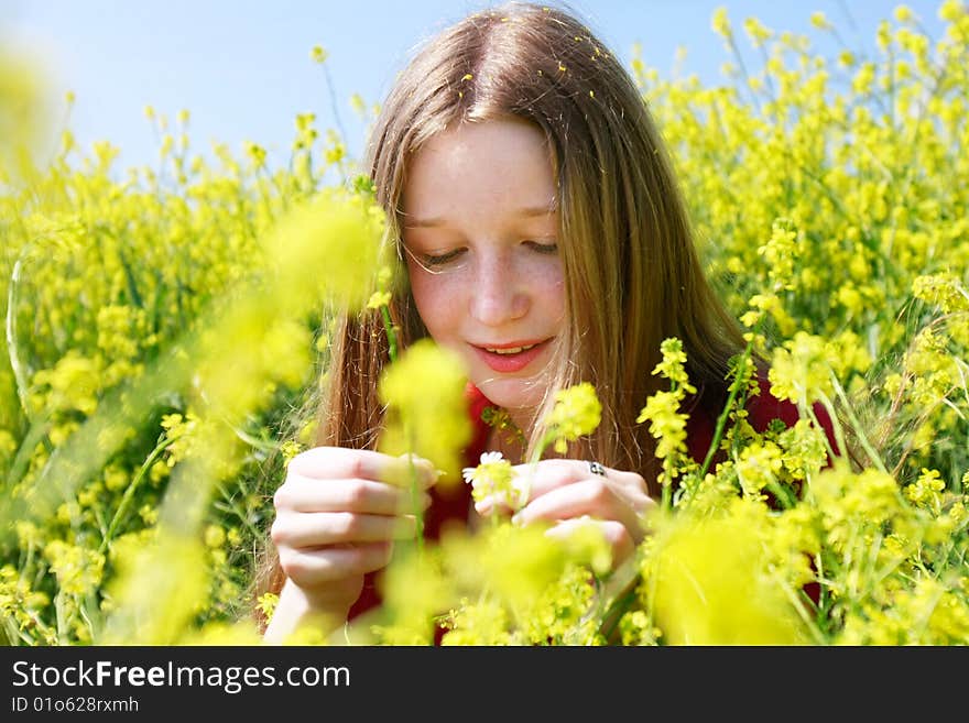 Girl with long hair in yellow flowers