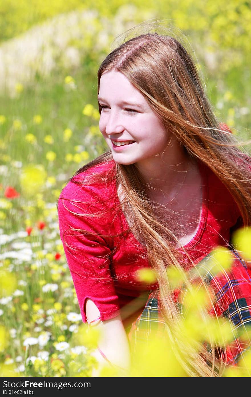 Girl With Long Hair On Summer Meadow