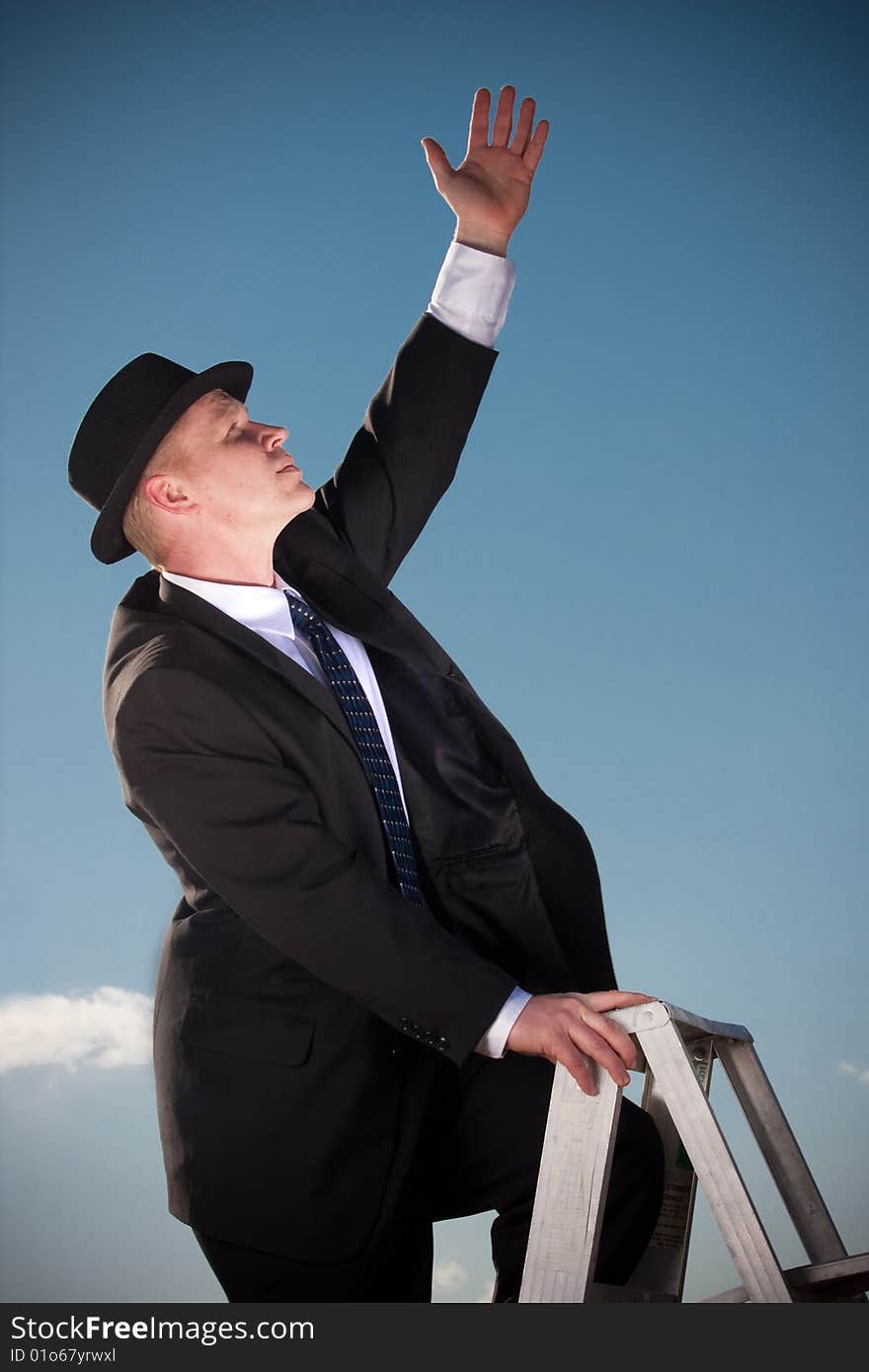 Man reaching from ladder