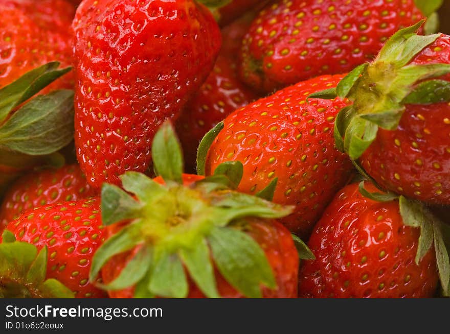 Closw-up fresh strawberries to background. Closw-up fresh strawberries to background