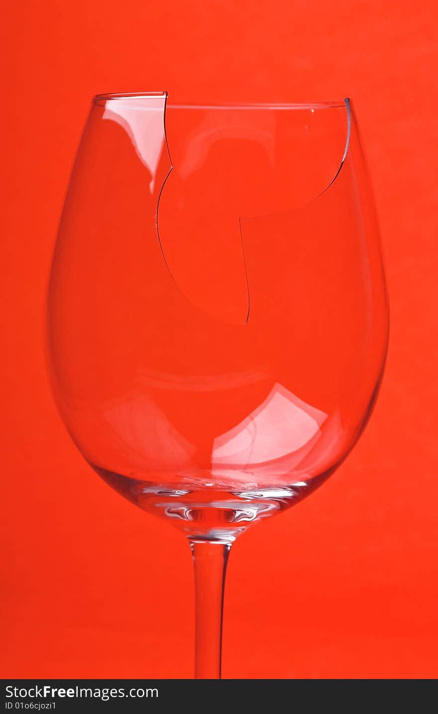 Close-up broken glass isolated on red background. Close-up broken glass isolated on red background