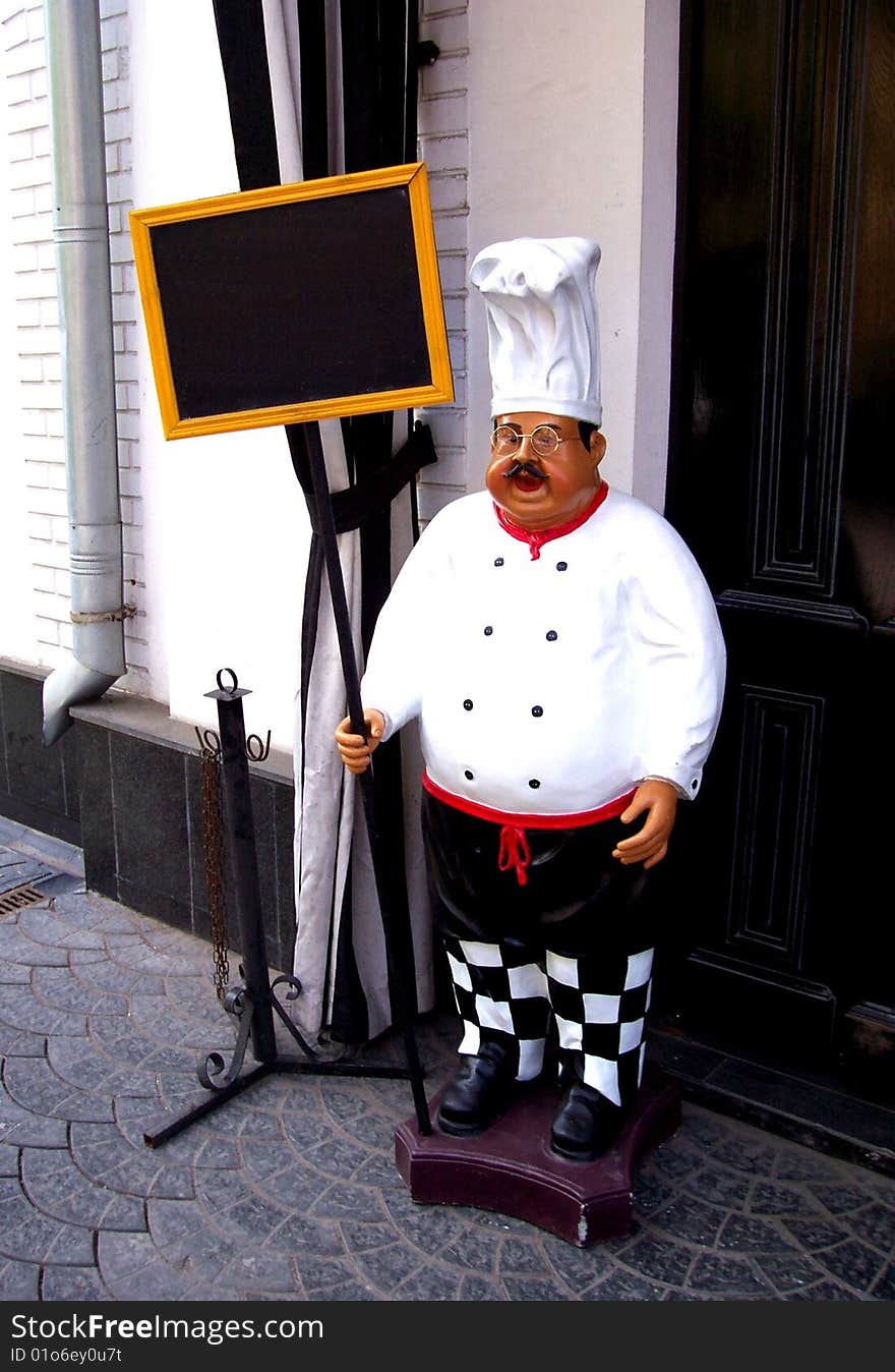 Statuette chefs at the door of the restaurant. Statuette chefs at the door of the restaurant