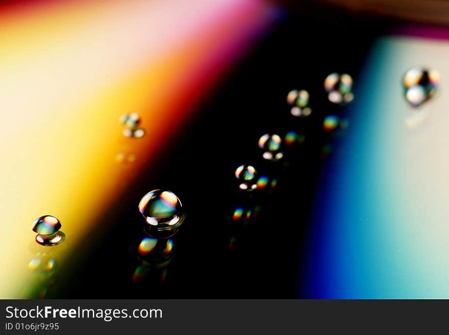 Colorful water drops reflecting lights