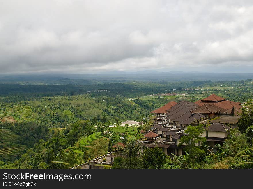 Hotel on green hills with a kind on a valley