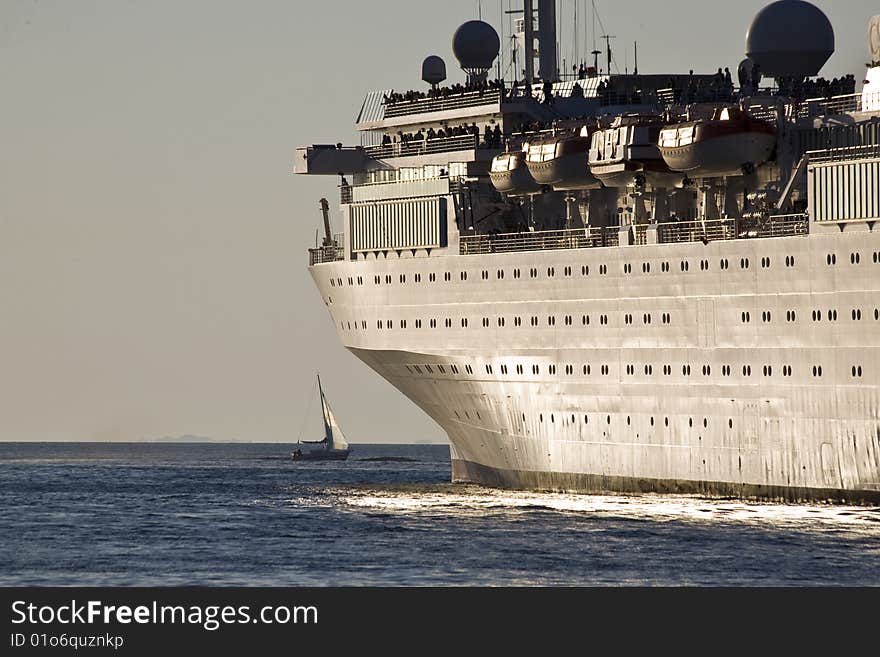 Departure of a cruise ship at sunset