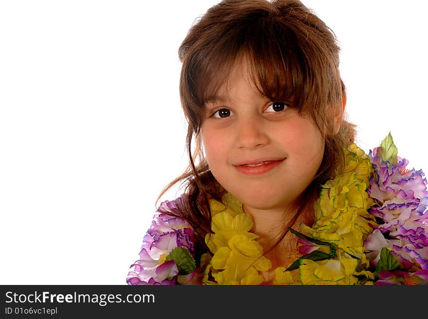 Portrait of a happy elementary girl dressed in multiple Hawaiian lies.  Isolated on white. Portrait of a happy elementary girl dressed in multiple Hawaiian lies.  Isolated on white.