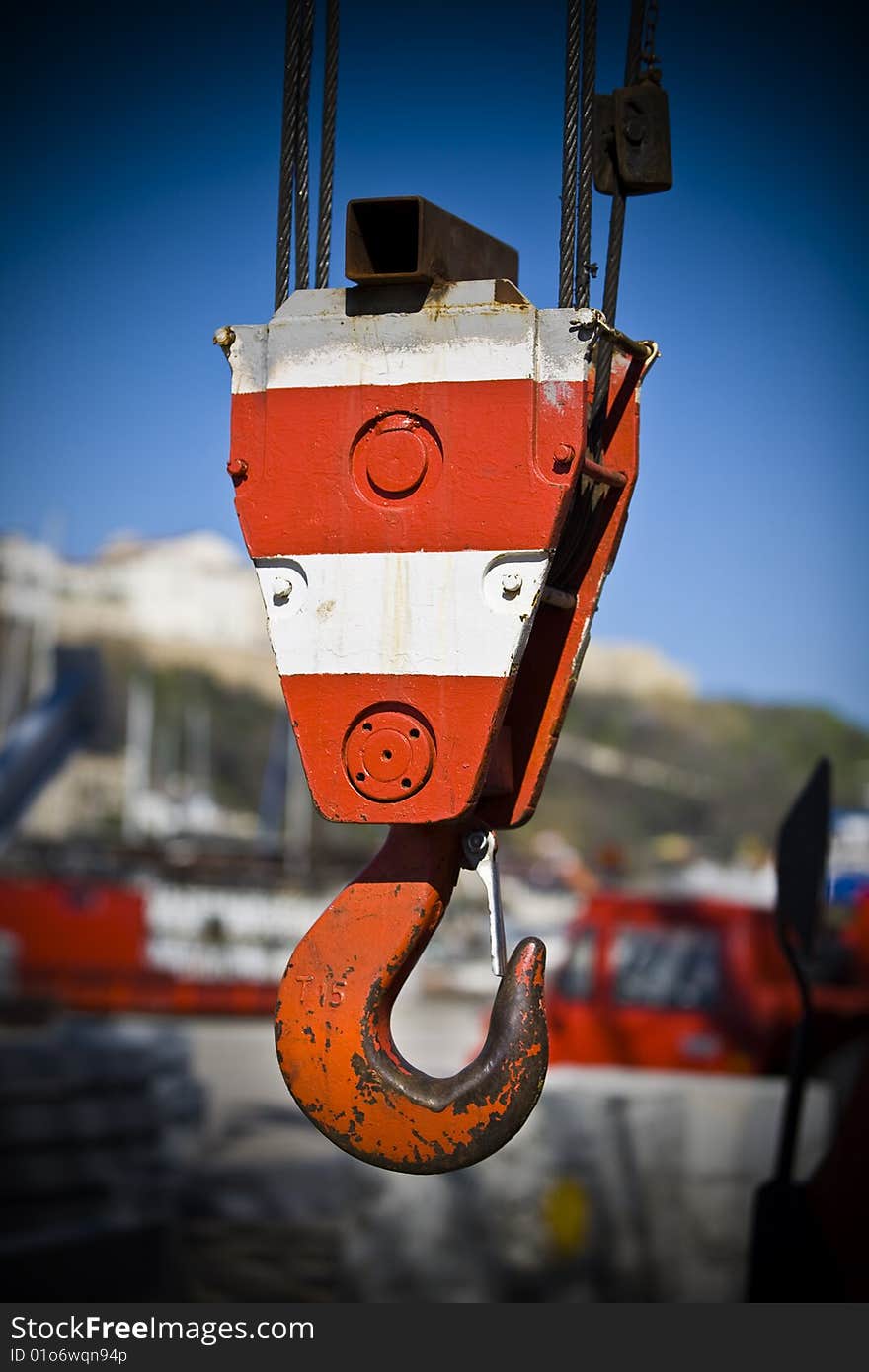 Detail of a hook of a crane to lift loads in a port