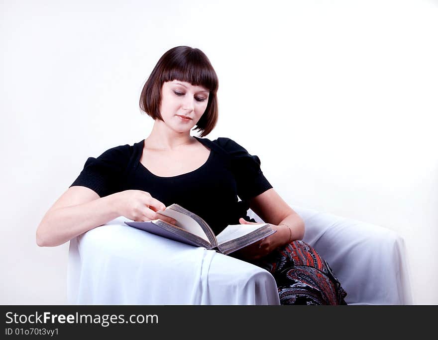 Young woman reading a book. Young woman reading a book