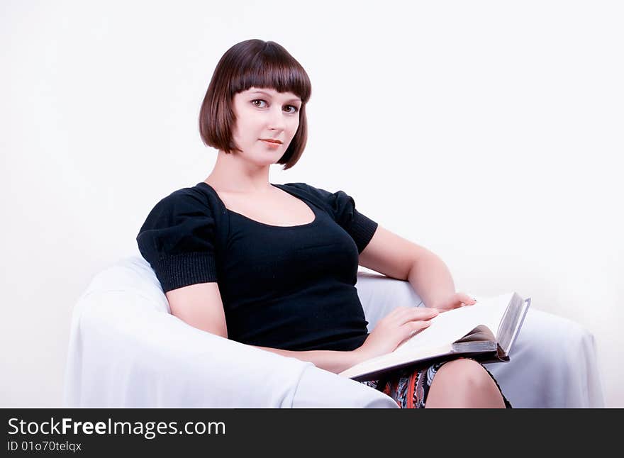 Young woman reading a book. Young woman reading a book