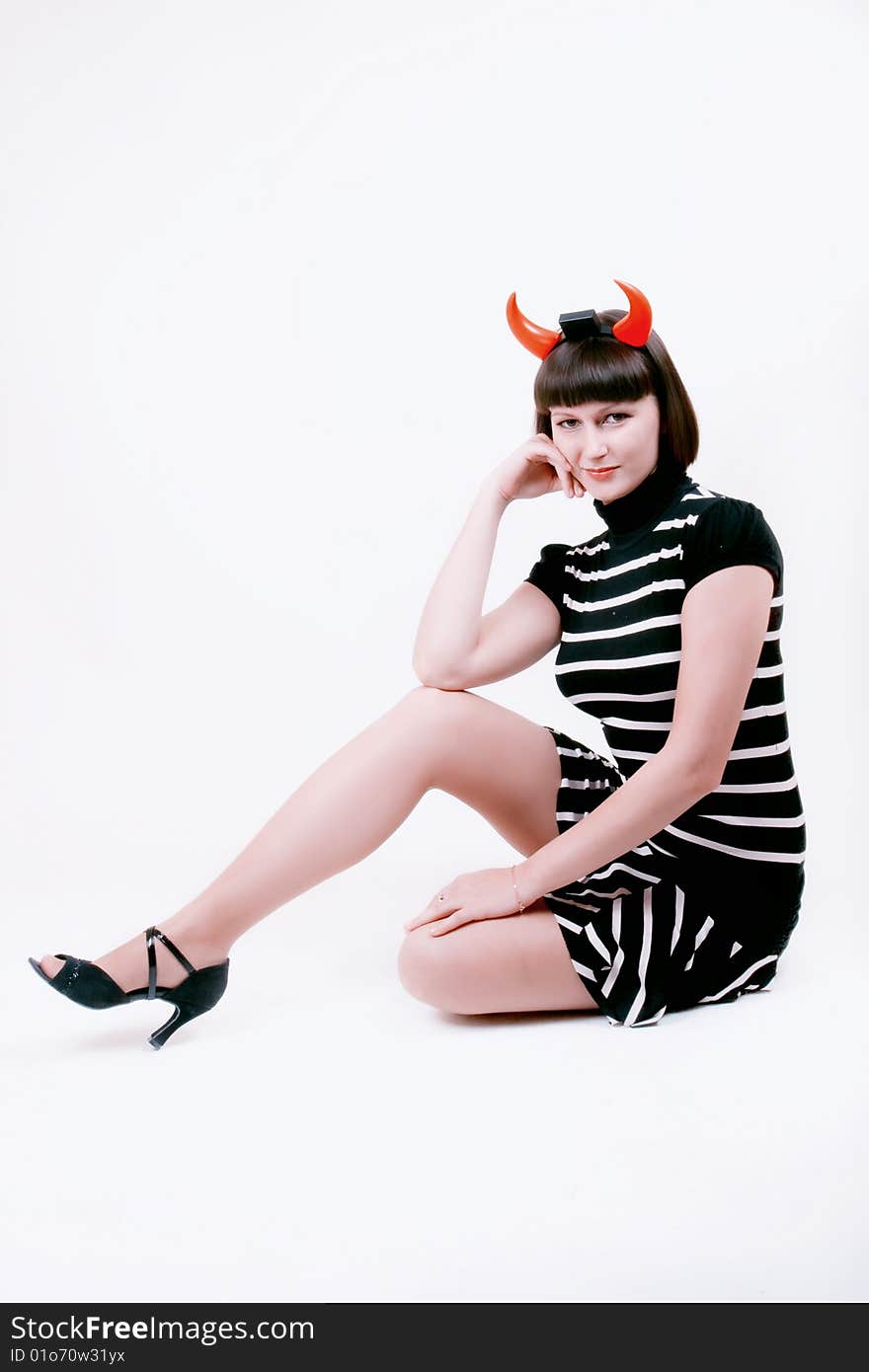 Portrait of a young woman with devilish horns. Portrait of a young woman with devilish horns