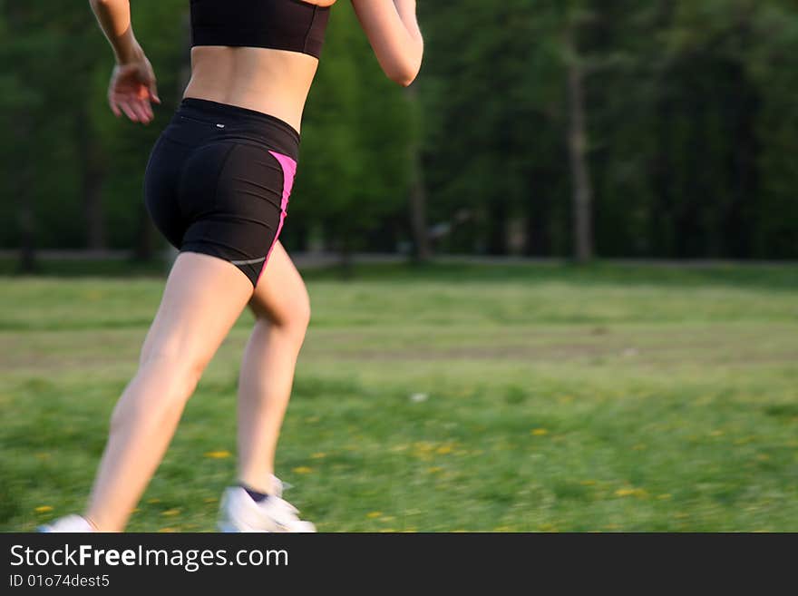 Young fitness woman running outdoor. Young fitness woman running outdoor