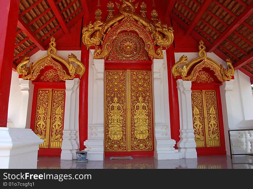 Red and gold painted doors in Thailand. Red and gold painted doors in Thailand