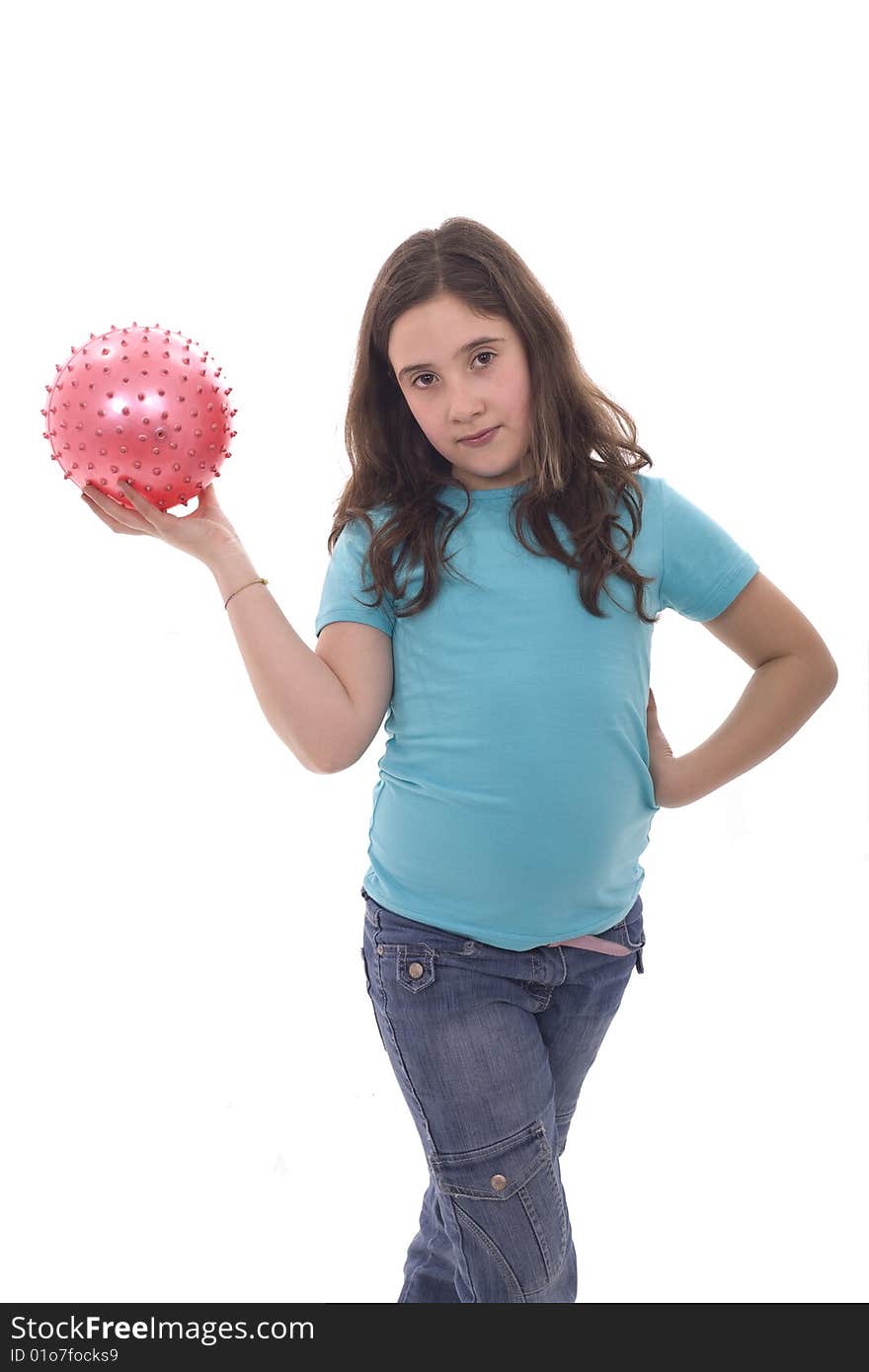 A young and cute girl holding a pink ball in her hand. A young and cute girl holding a pink ball in her hand