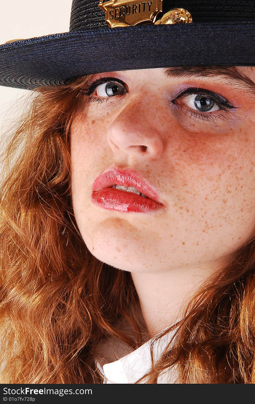 Close-up shoot of a pretty security guard from a shopping mall in the US
in her uniform with her bright red hair. Close-up shoot of a pretty security guard from a shopping mall in the US
in her uniform with her bright red hair.